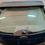 TAMPA DA MALA FORD FOCUS II 04-07