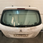 TAMPA DA MALA PEUGEOT 207